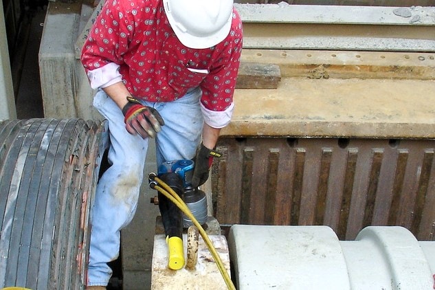 worker with torque wrench